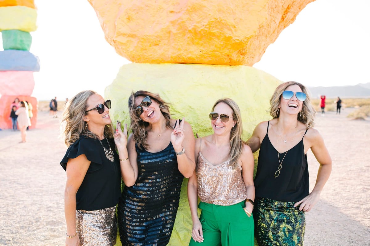 Women smiling in the desert